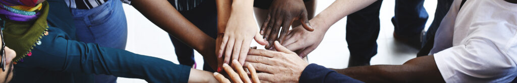 Diversity teamwork with joined hands